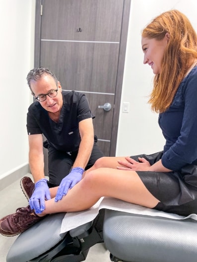 Dr. Thomas Arnold with a patient - Vein Treatment Clinic