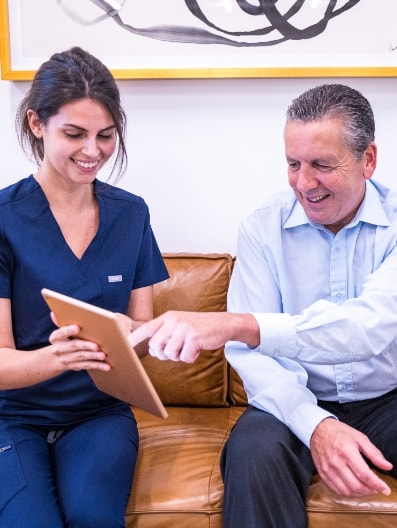 Nurse with a patient - Vein Treatment Clinic